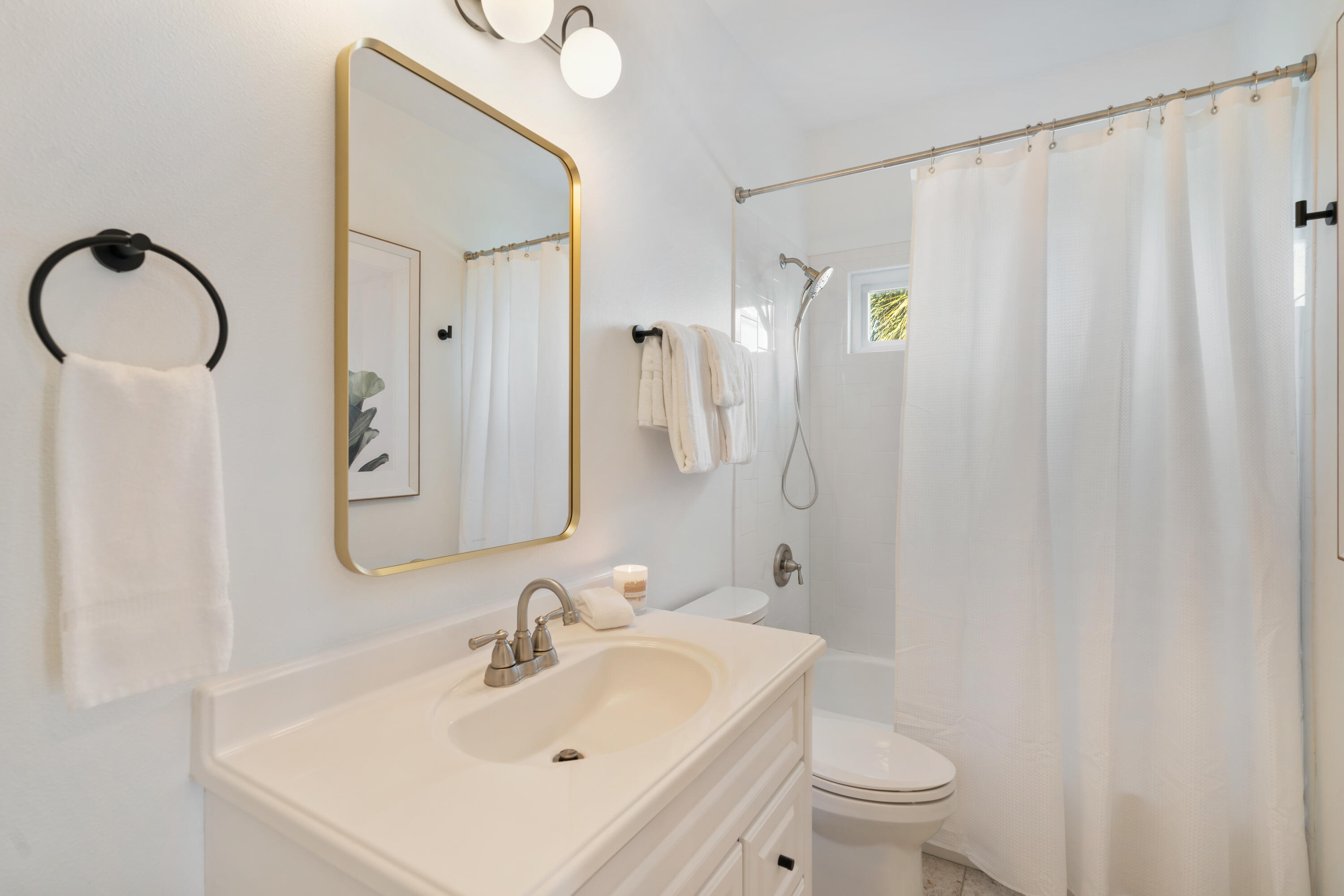 83 Brown Street Santa Rosa Beach, FL 32459 - Photo 19 of 42 a bathroom with a sink vanity mirror and toilet