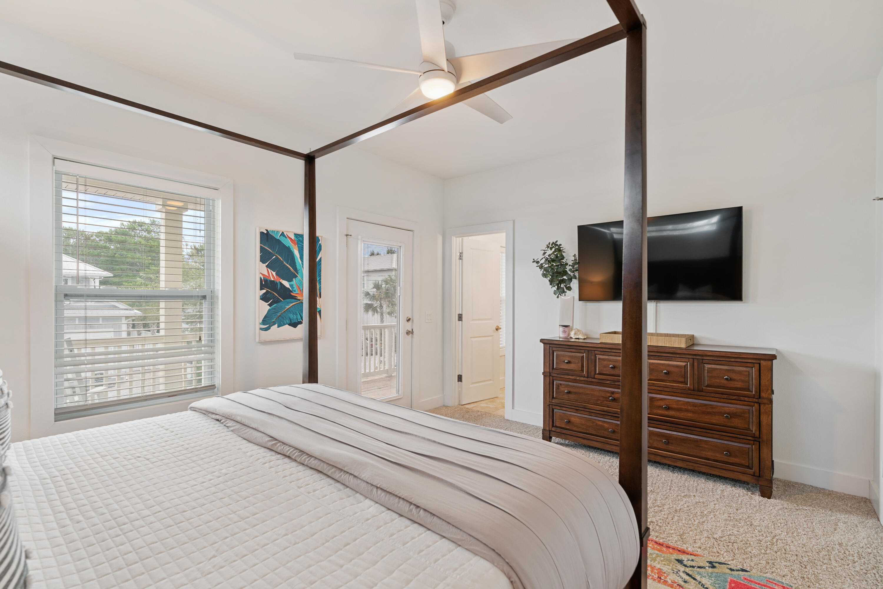 83 Brown Street Santa Rosa Beach, FL 32459 - Photo 25 of 42 a bedroom with a bed and a flat screen tv