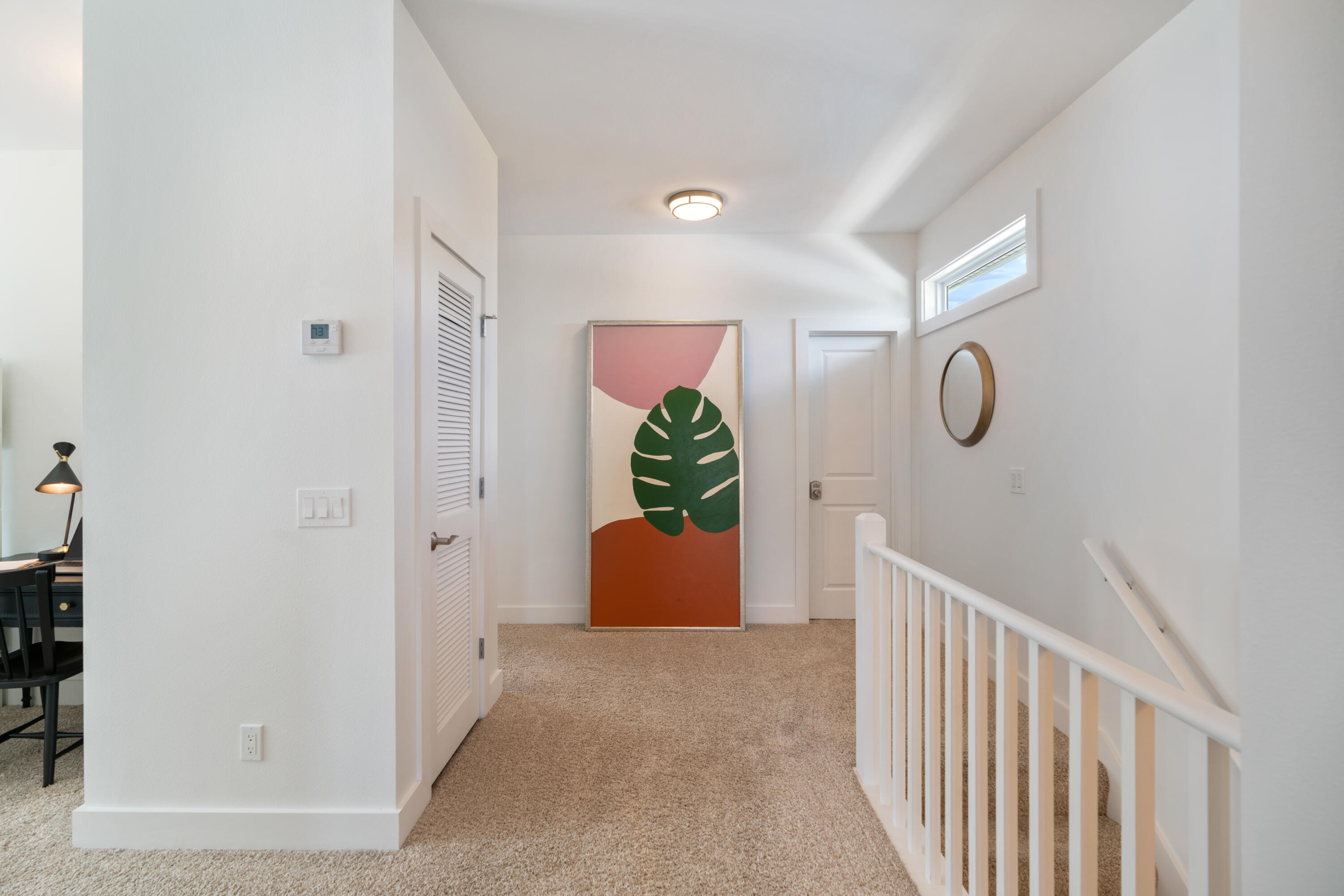 83 Brown Street Santa Rosa Beach, FL 32459 - Photo 29 of 42 a view of a hallway to room with wooden floor and windows