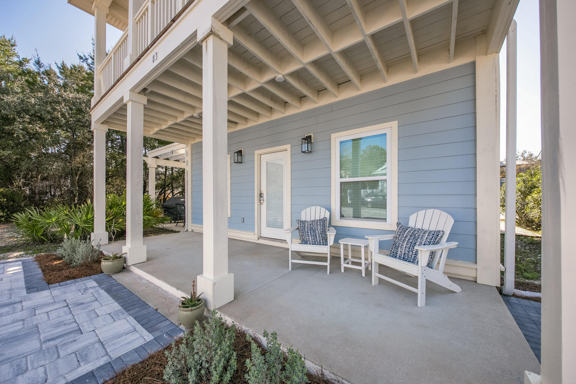 83 Brown Street Santa Rosa Beach, FL 32459 - Photo 33 of 42 a view of a patio with a table and chairs and a barbeque