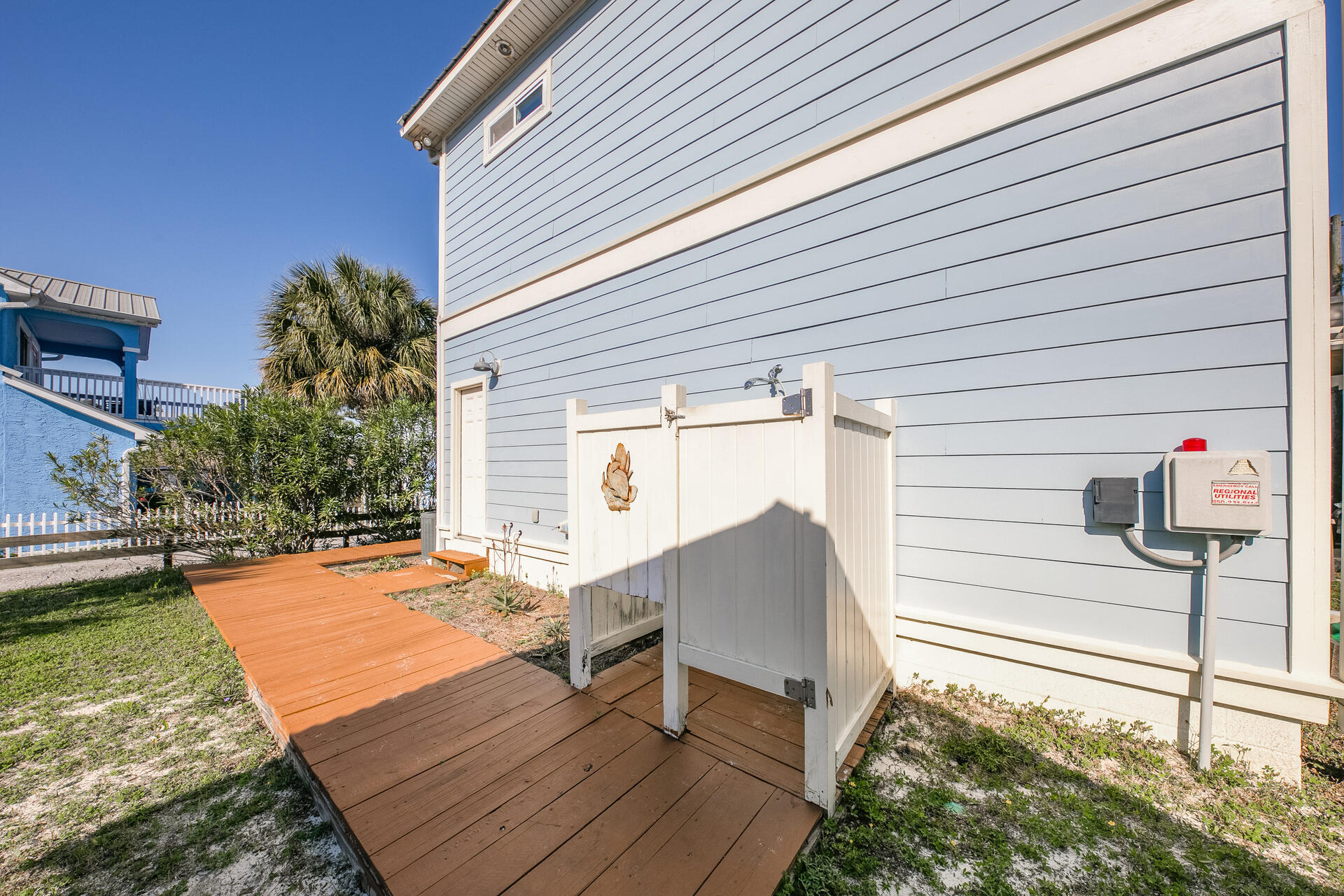 83 Brown Street Santa Rosa Beach, FL 32459 - Photo 36 of 42 a backyard of a house with wooden floor and outdoor seating