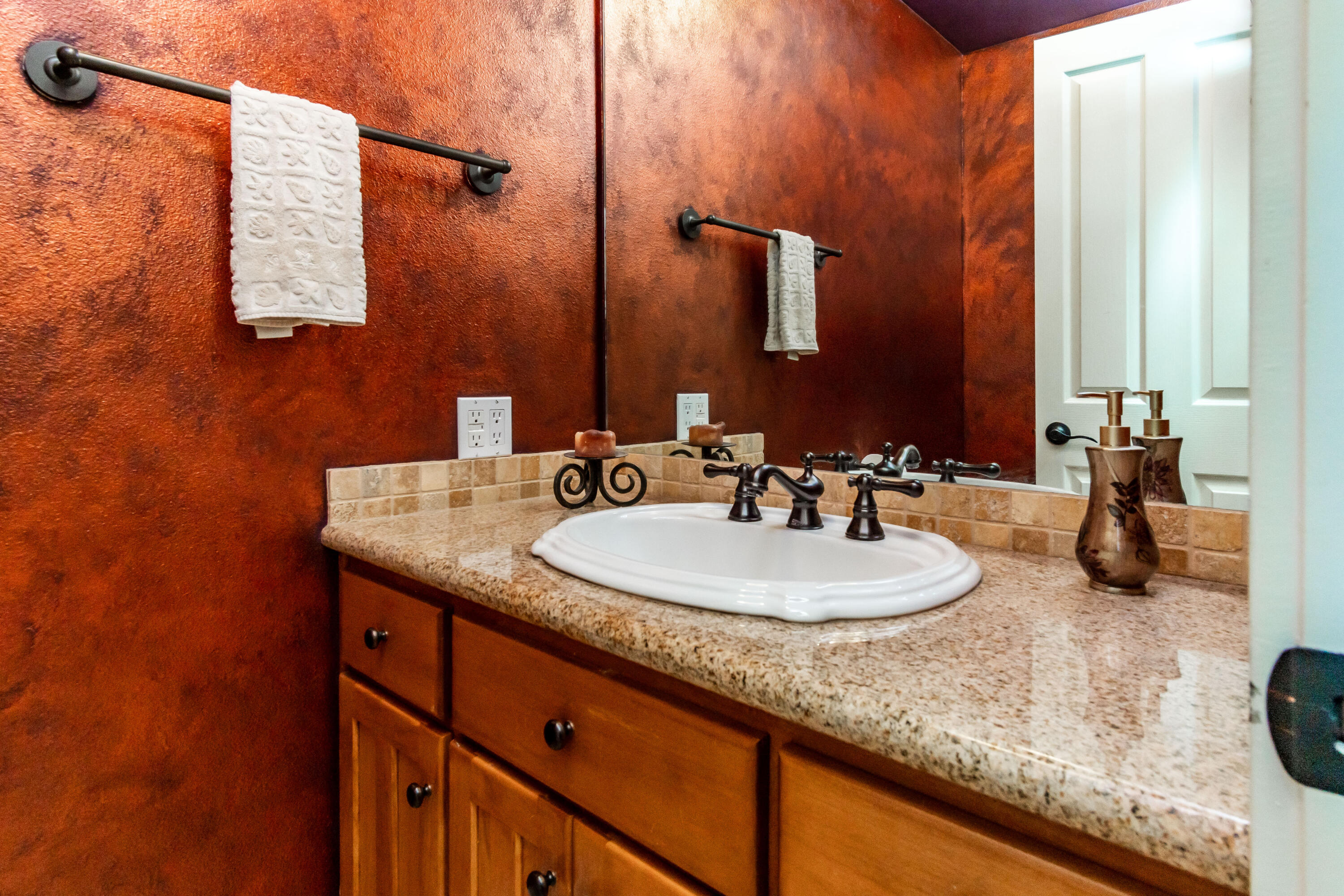 22234 Nelson Road Bend, OR 97701 - Photo 19 of 60 a bathroom with a granite countertop sink and a mirror