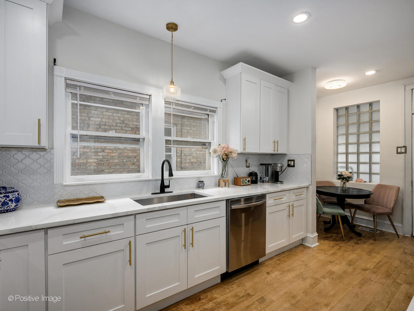 3742 Clinton Avenue Berwyn, IL 60402 - Photo 11 of 28 a kitchen with a sink stove and cabinets