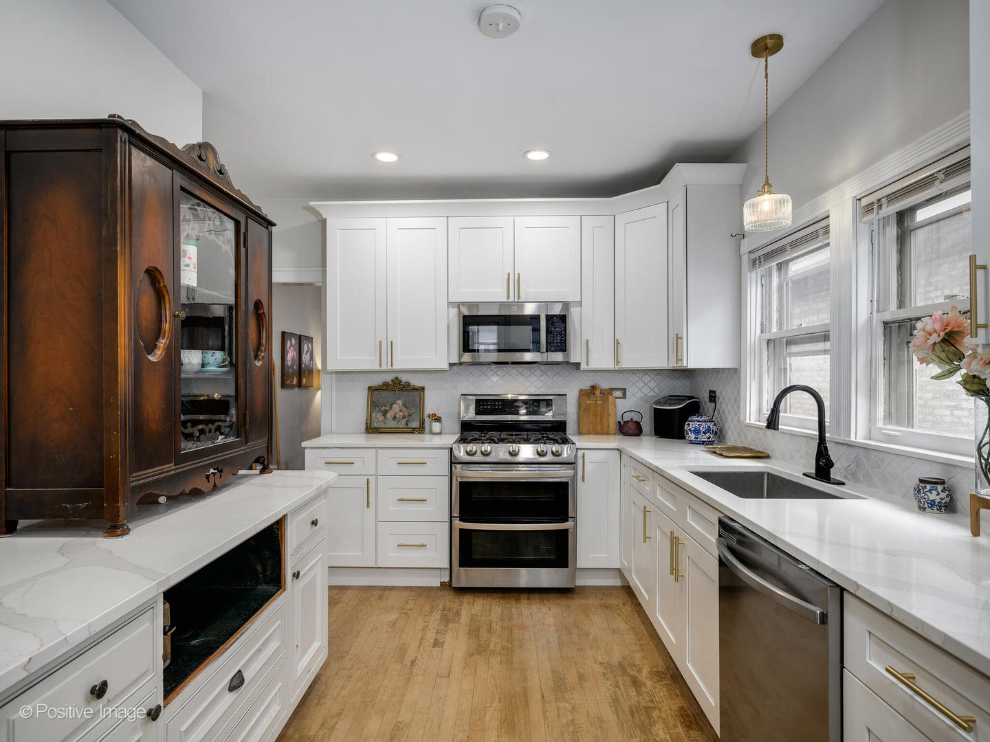 3742 Clinton Avenue Berwyn, IL 60402 - Photo 13 of 28 a kitchen with stainless steel appliances granite countertop a sink and cabinets