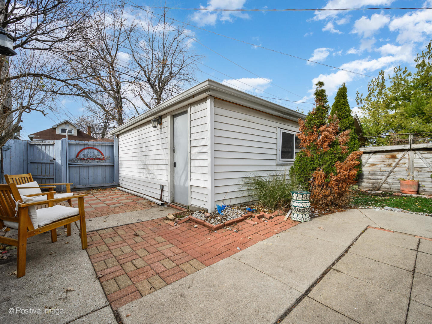 3742 Clinton Avenue Berwyn, IL 60402 - Photo 27 of 28 a backyard of a house with table and chairs