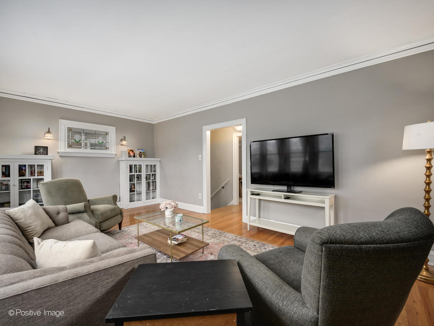 3742 Clinton Avenue Berwyn, IL 60402 - Photo 5 of 28 a living room with furniture and a flat screen tv