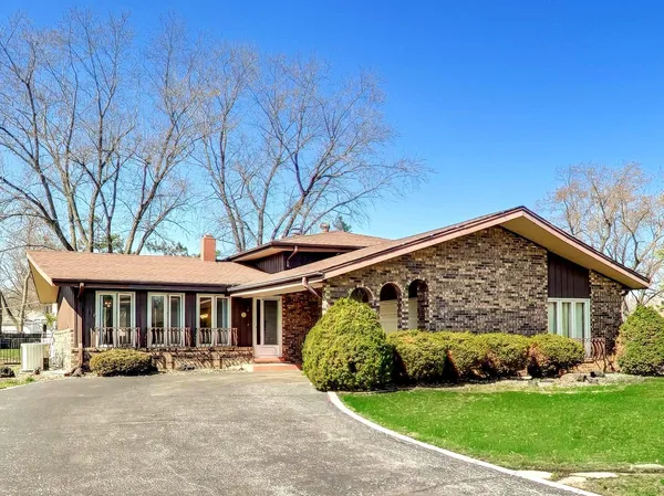 a front view of a house with yard porch and patio