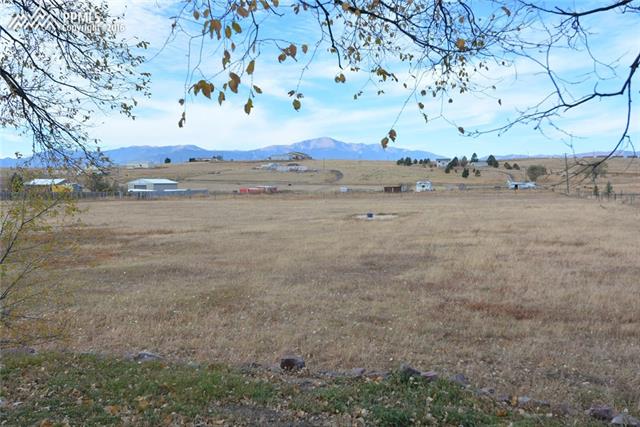 5720 Sayres Road Colorado Springs, CO 80927 - Photo 26 of 31 Huge pasture for horses or to simply enjoy the Pikes Peak mountain view and wide open space!