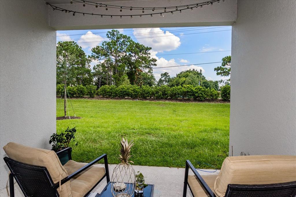 5616 Quiet Palm Loop St. Cloud, FL 34771 - Photo 16 of 25 a view of a yard with furniture