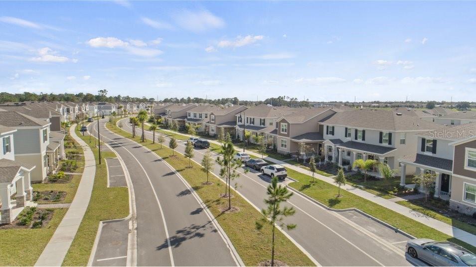 5616 Quiet Palm Loop St. Cloud, FL 34771 - Photo 19 of 25 a view of a city with tall buildings