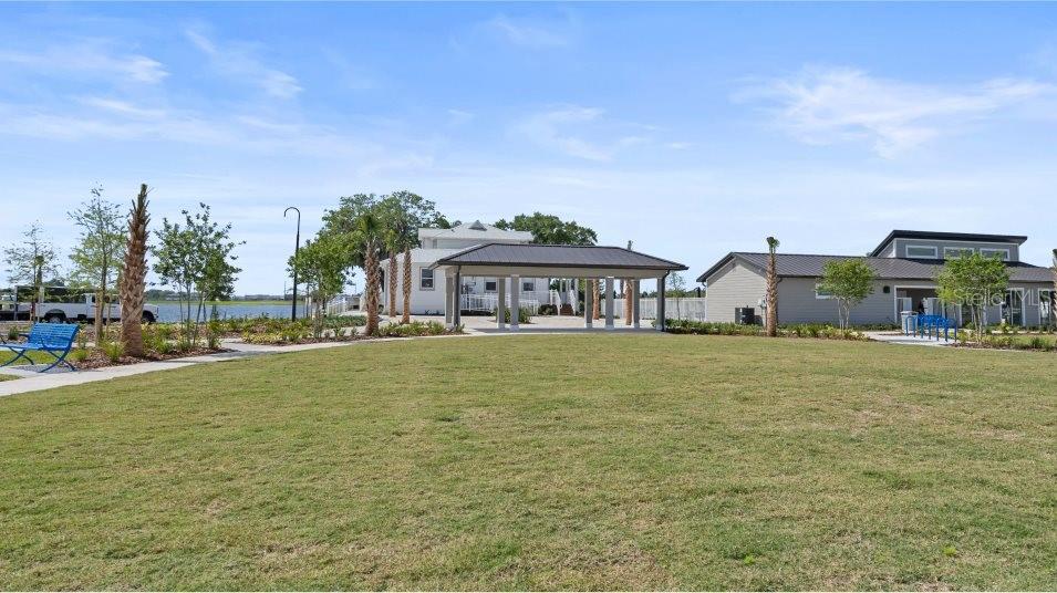 5616 Quiet Palm Loop St. Cloud, FL 34771 - Photo 21 of 25 a front view of house with outdoor space and seating