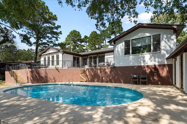 a view of house with a yard