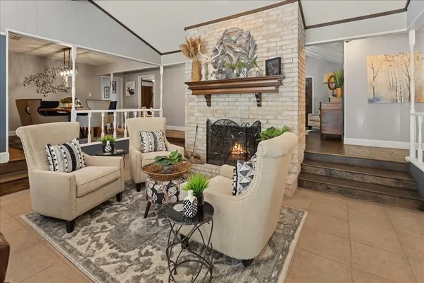a living room with furniture and a fireplace
