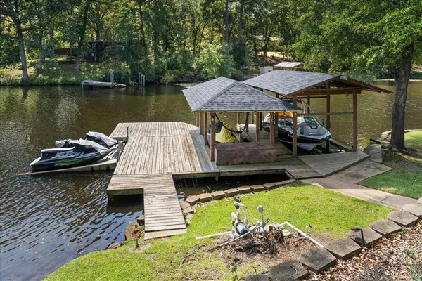 an aerial view of a house with swimming pool garden and patio