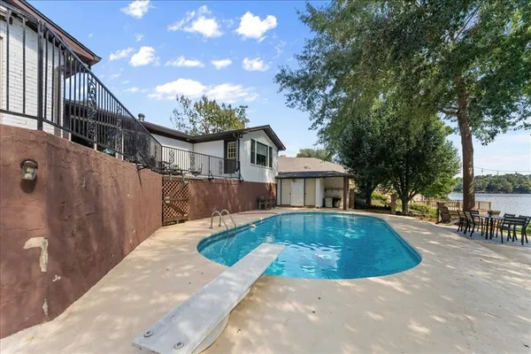 a view of a house with a swimming pool