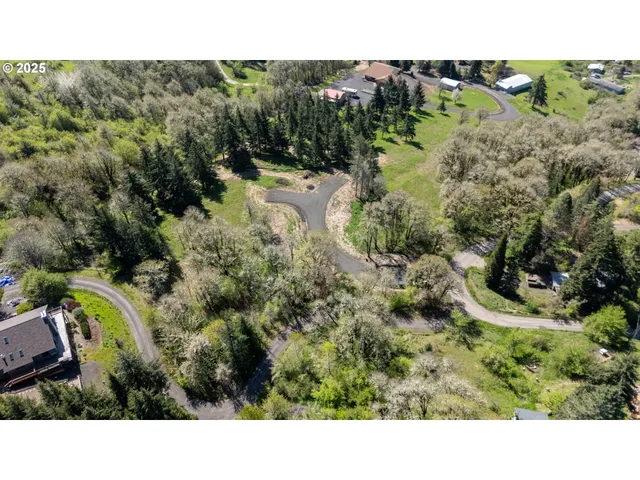 a view of a garden with a house