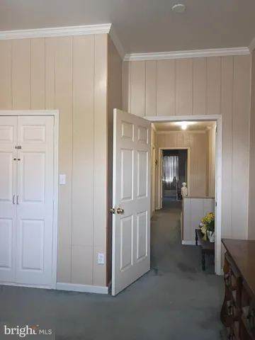 a view of livingroom with hardwood floor and cabinet