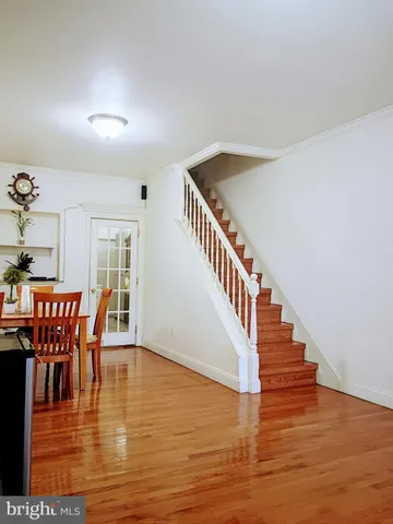 a view of dining room with furniture and wooden floor