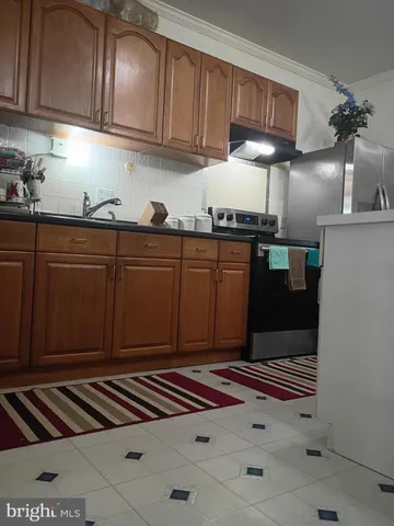 a view of kitchen with cabinets