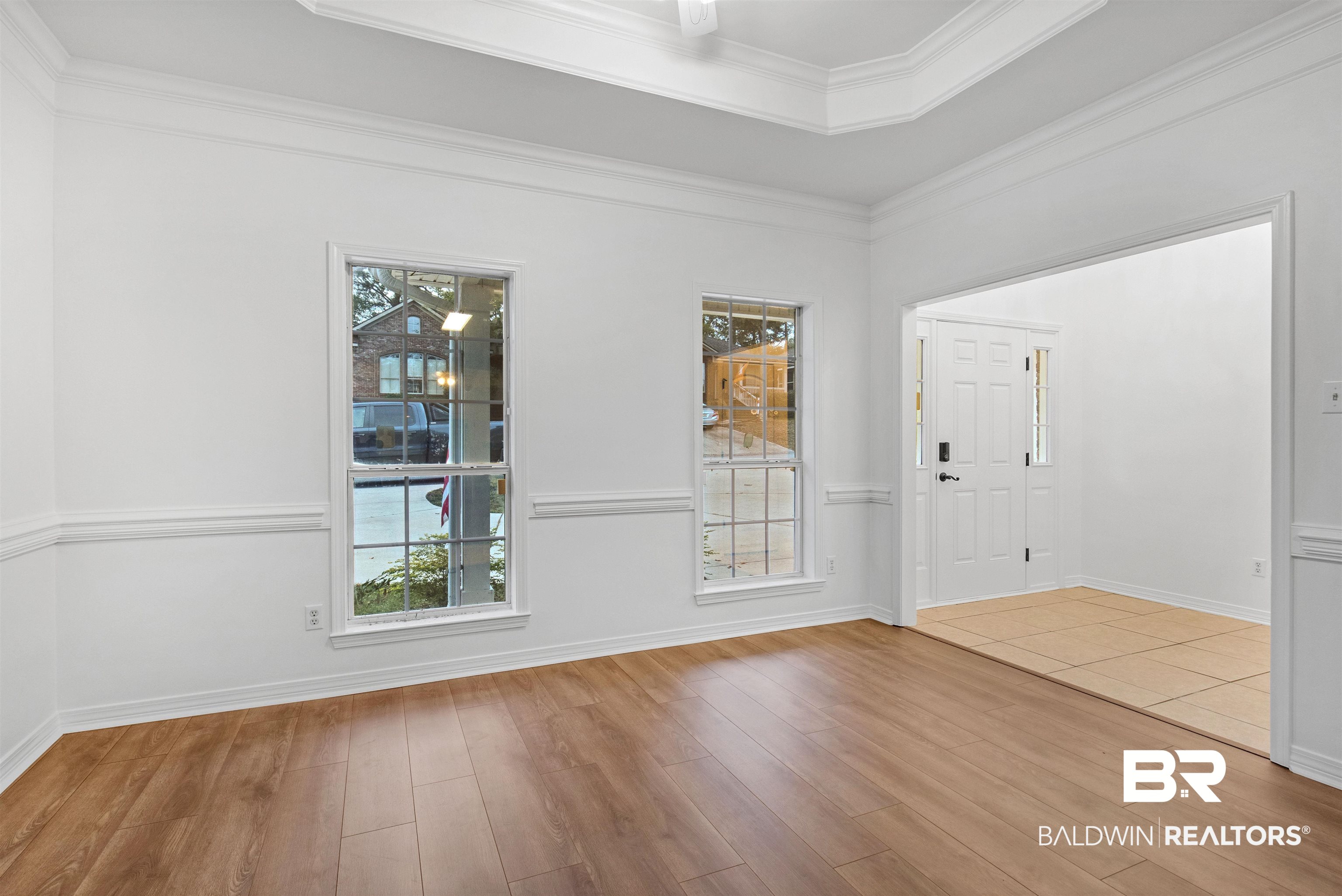 1007 Linlen Avenue Mobile, AL 36609 - Photo 8 of 21 Spare room featuring hardwood / wood-style floors and crown molding
