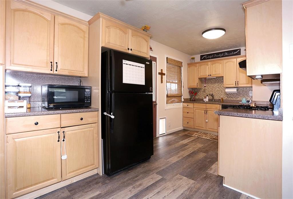 2154 Swallow Hill Road Pittsburgh, PA 15220 - Photo 5 of 22 Bright, pretty kitchen with great layout to prepare your meals. Door leads out to back patio - easy access for grilling.