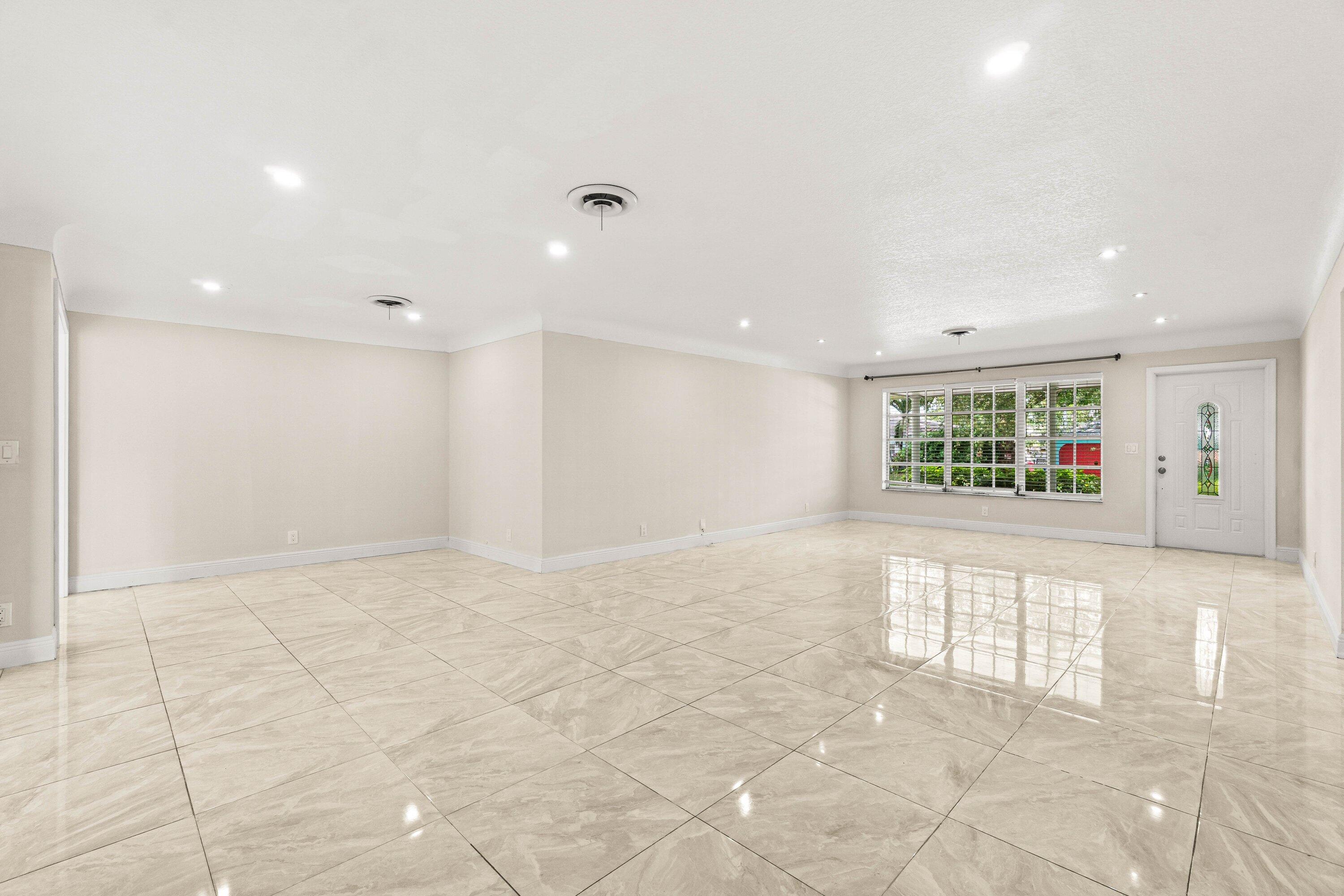 1290 Southwest 8th Street Boca Raton, FL 33486 - Photo 3 of 29 a view of an empty room with a window