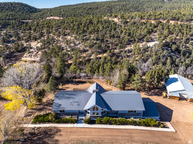 6 South N Frk Road Orderville, UT 84758 - Photo 2 of 68 View of subject property with a heavily wooded area and a mountainous background