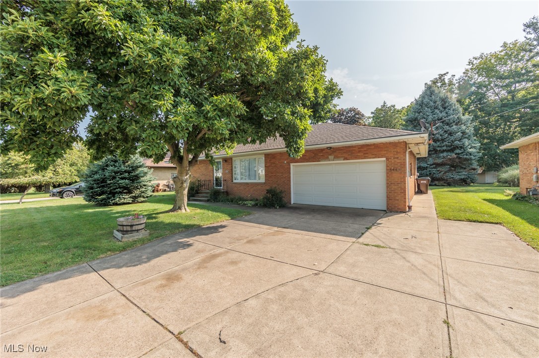 5445 Hauserman Road Cleveland, OH 44130 - Photo 2 of 45 View of front of home with a front yard and a garage