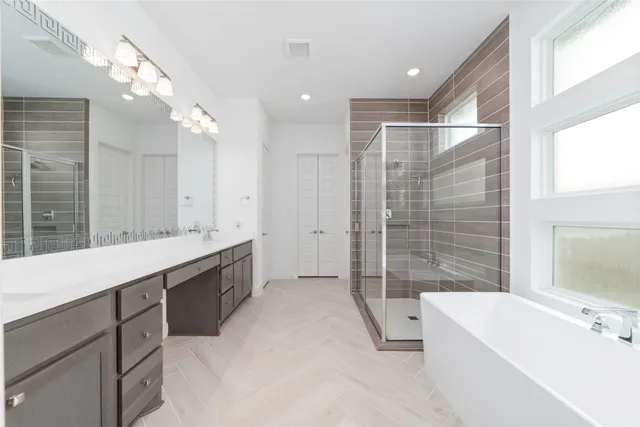 a kitchen with stainless steel appliances a sink stove and cabinets