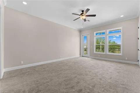 a view of a livingroom with a ceiling fan and window