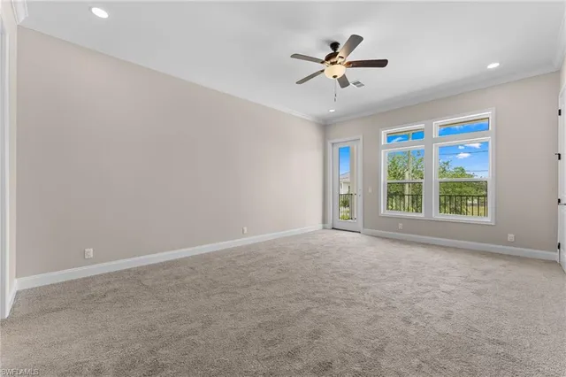 a view of a livingroom with a ceiling fan and window