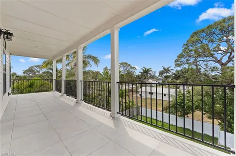 a view of balcony with furniture