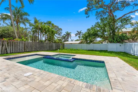 a view of swimming pool with a yard