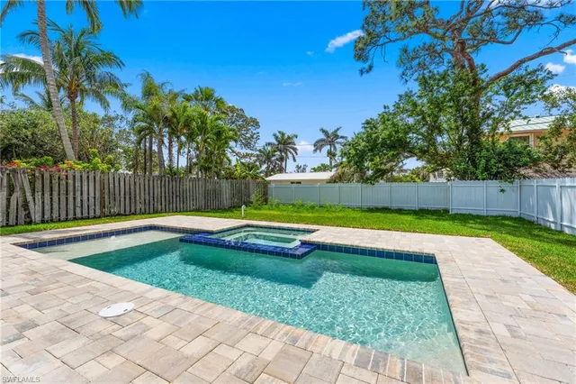 a view of swimming pool with a yard