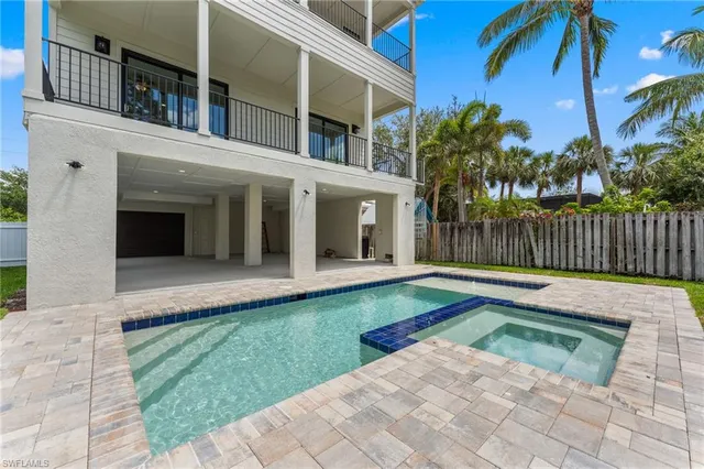 a view of a house with a yard and plants