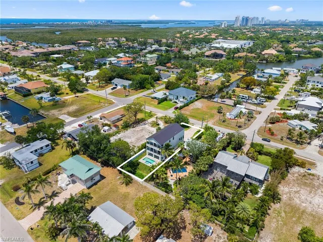 an aerial view of residential houses with outdoor space