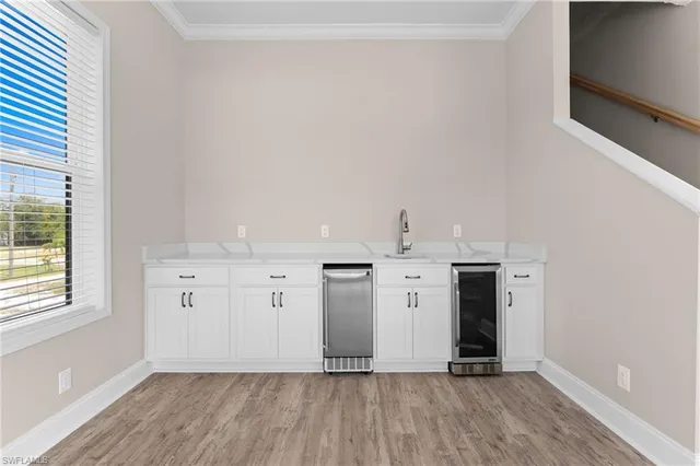 a view of a kitchen with wooden floor