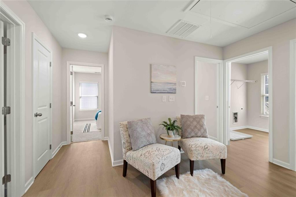3489 Fairview Road, Unit MAGNOLIA Covington, GA 30016 - Photo 20 of 29 a living room with furniture and a wooden floor