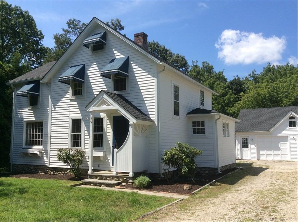 front view of a house with a yard