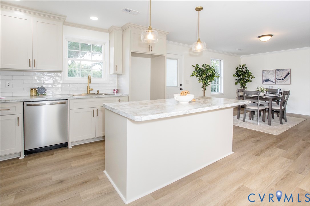 14734 Halifax Road Carson, VA 23830 - Photo 2 of 29 a kitchen with a table chairs stove and microwave