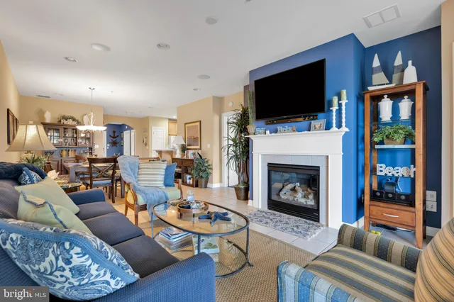 a living room with furniture fireplace and a flat screen tv