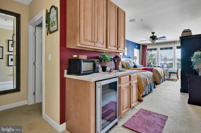 a view of a kitchen area with furniture and staircase