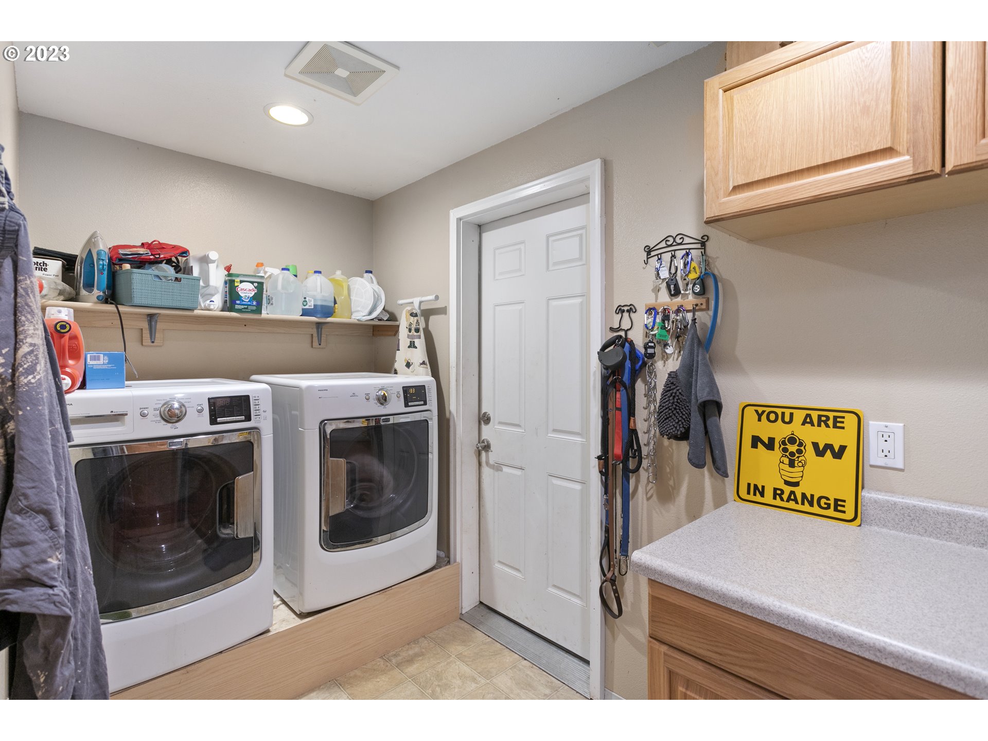200 Oak Point Road Longview, WA 98632 - Photo 23 of 47 a utility room with fridge dryer and washer