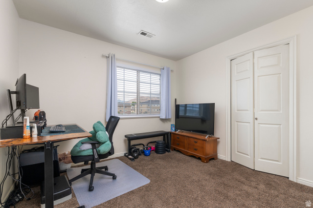 25 West Ridge Road, Unit 25 Saratoga Springs, UT 84045 - Photo 8 of 22 Carpeted room featuring a window with horizontal blinds, bi-fold closet doors, and recessed lighting