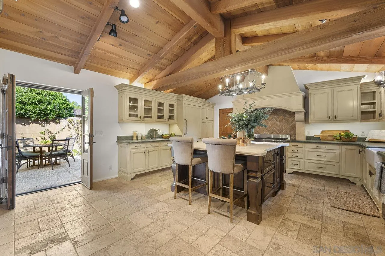 6101 Camino Selva Rancho Santa Fe, CA 92067 - Photo 11 of 35 a view of a dining area with furniture window and outside view