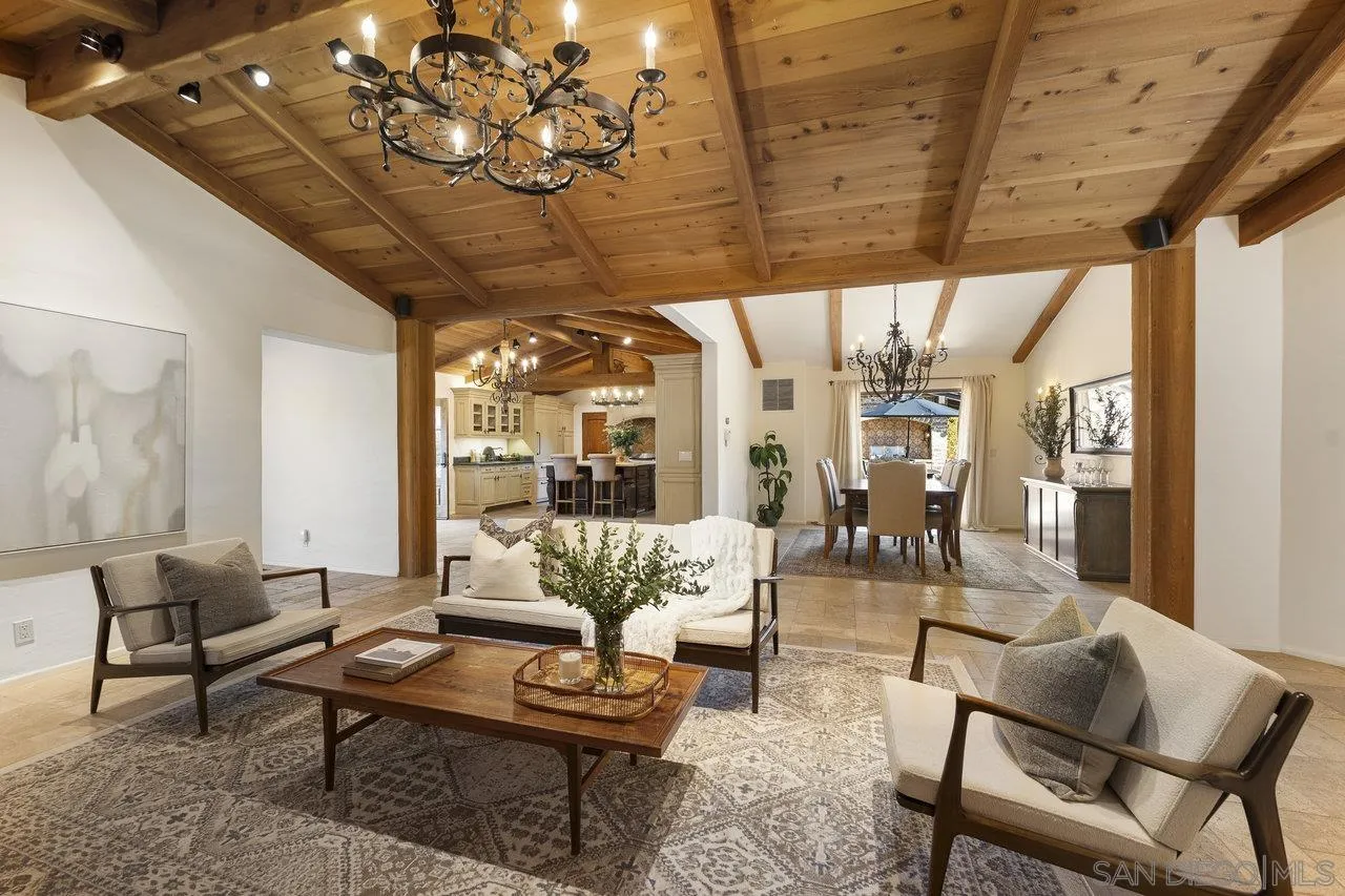 6101 Camino Selva Rancho Santa Fe, CA 92067 - Photo 13 of 35 a living room with furniture and a chandelier