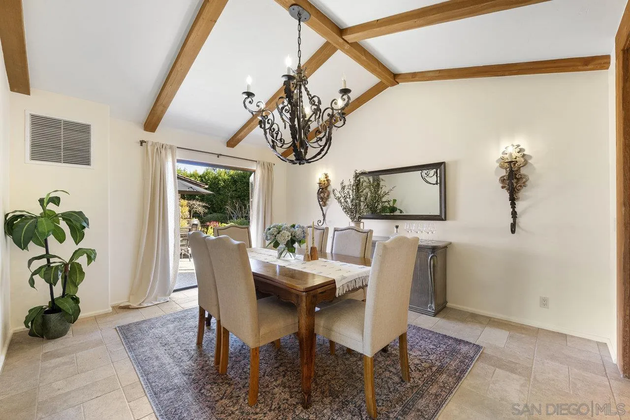6101 Camino Selva Rancho Santa Fe, CA 92067 - Photo 15 of 35 a dining room with furniture potted plants and wooden floor