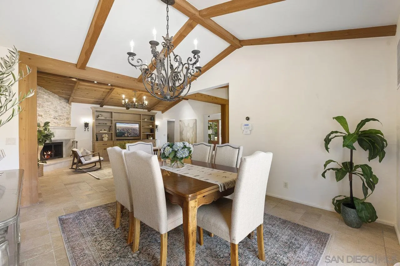 6101 Camino Selva Rancho Santa Fe, CA 92067 - Photo 16 of 35 a view of a dining room with furniture and a potted plant