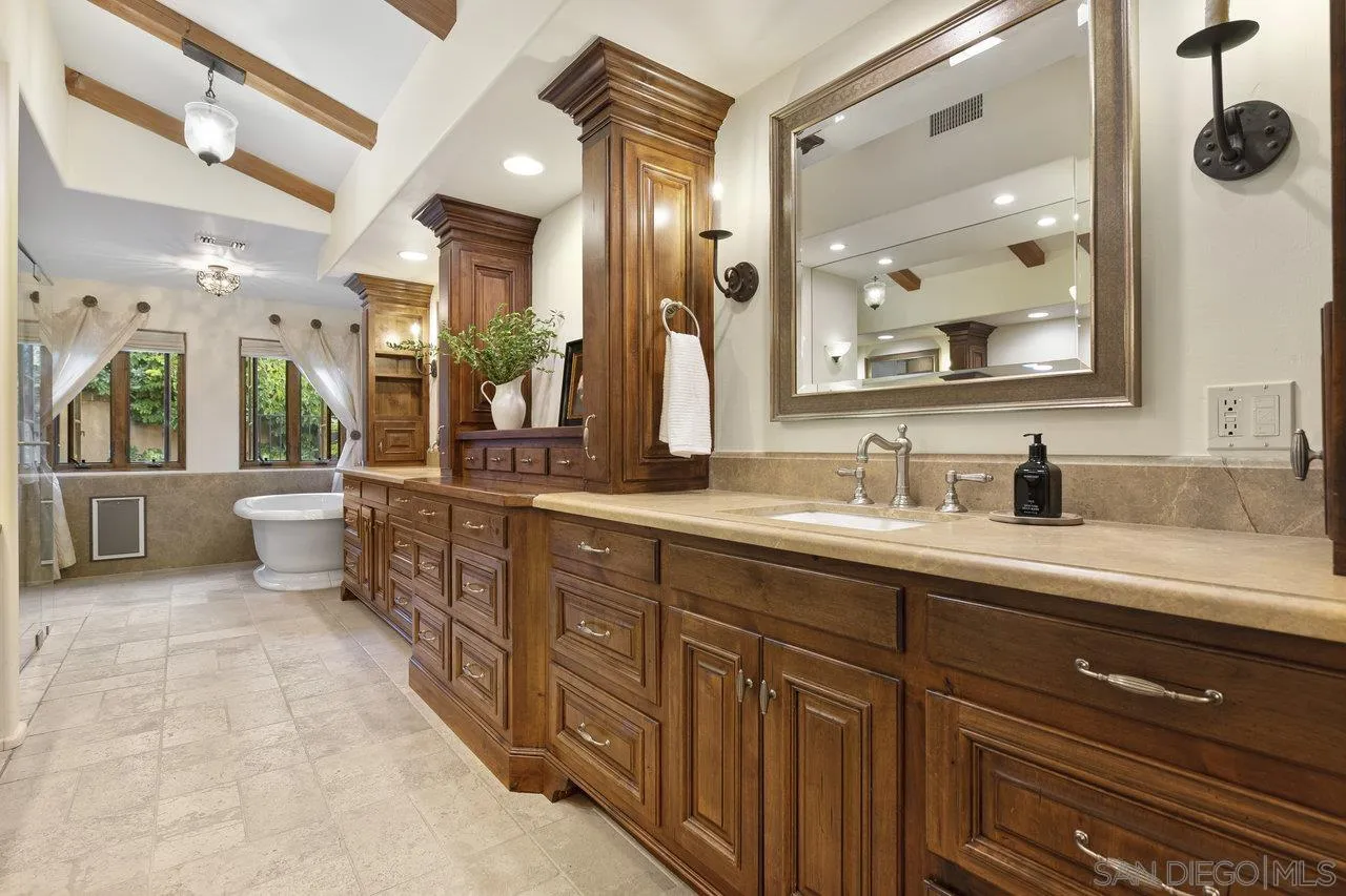 6101 Camino Selva Rancho Santa Fe, CA 92067 - Photo 21 of 35 a spacious bathroom with a double vanity sink and a mirror