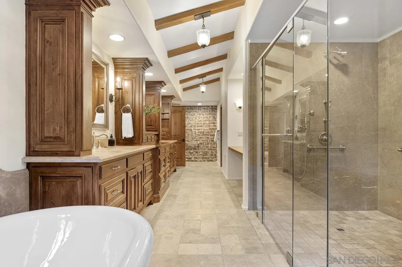 6101 Camino Selva Rancho Santa Fe, CA 92067 - Photo 23 of 35 a bathroom with a double vanity sink and a mirror